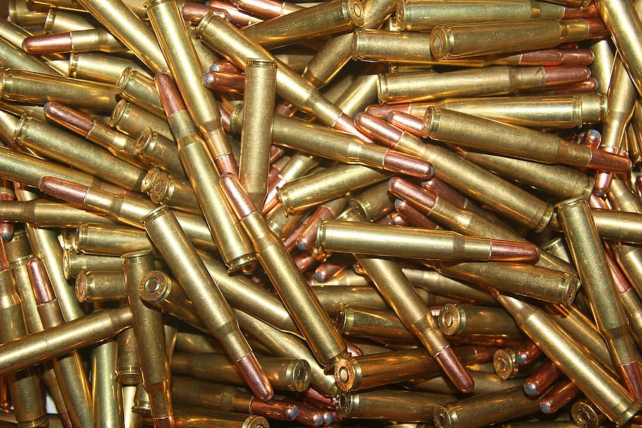 closeup photo of bunch of bullets, ammunition, 30-06, long arms ammunition