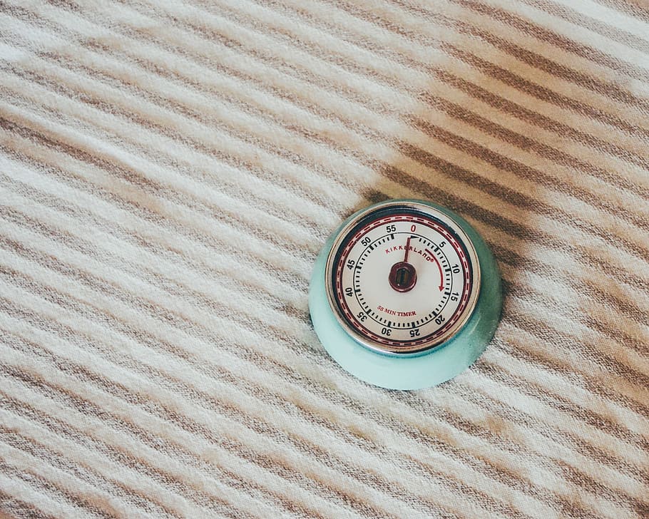 round teal gauge on white textile, round blue timer on gray cloth HD wallpaper