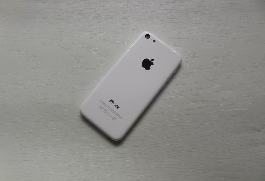 white iPhone 5C on white board, apple iphone, mobile phone, indoors