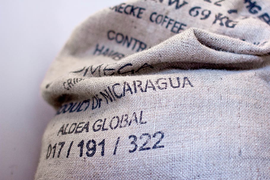 burlap, sack, coffee, text, western script, close-up, focus on foreground HD wallpaper