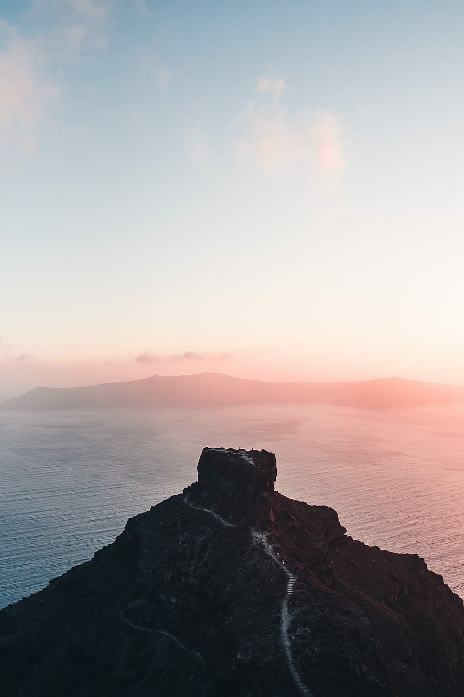 black mountain with body of water during daytime, aerial view of island HD wallpaper