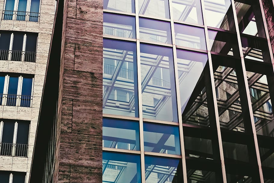 close up photo of brown concrete frame glass high rise building HD wallpaper