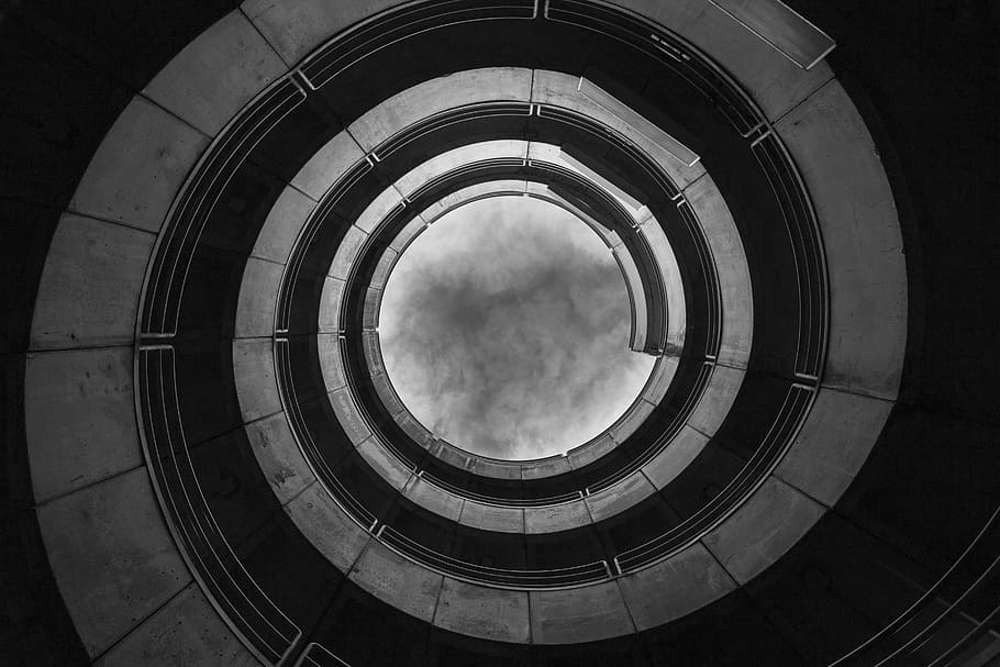 low angle view grayscale photography of spiral building, worms-eye view photography of spiral staircase in grayscale HD wallpaper