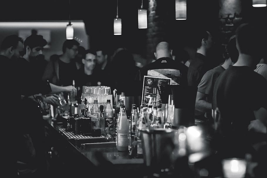 grayscale photo of group of people at the bar, human, bottles