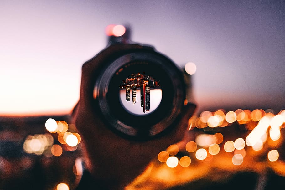 shallow focus photography of person holding camera lens, person holding DSLR camera lens HD wallpaper
