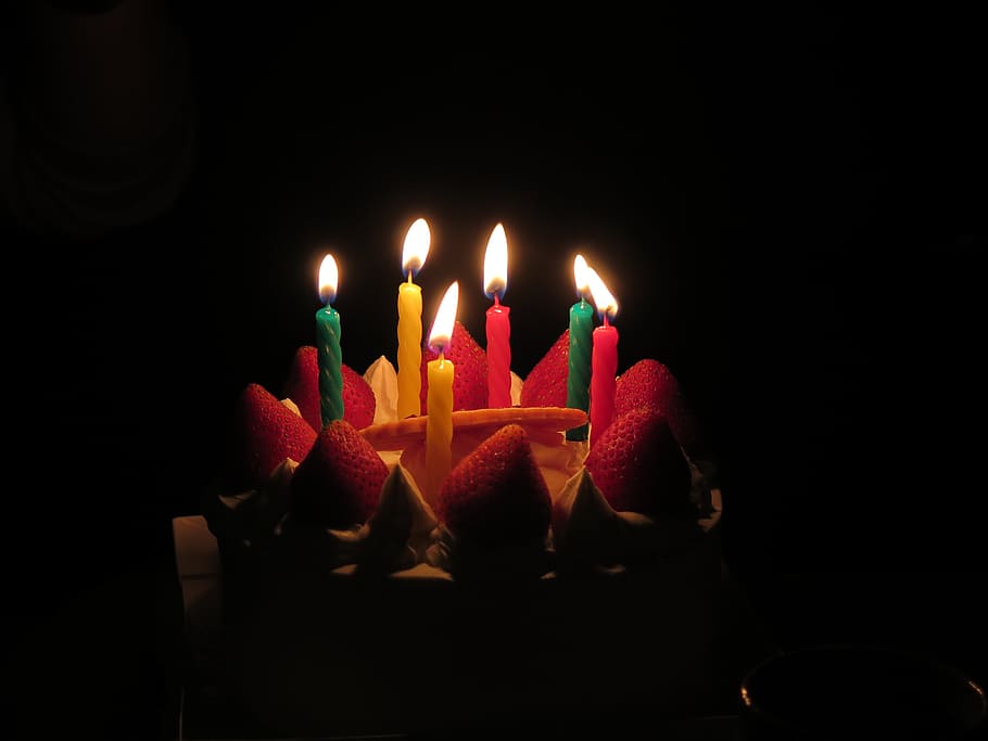 lighted candles on strawberry cake, birthday candles, dark, flames