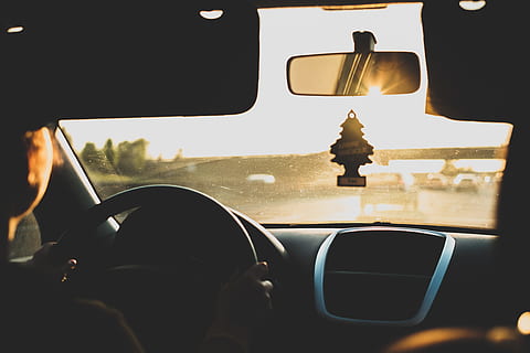 person driving car during daytime, person sitting on driver's seat inside vehicle during golden hour HD wallpaper