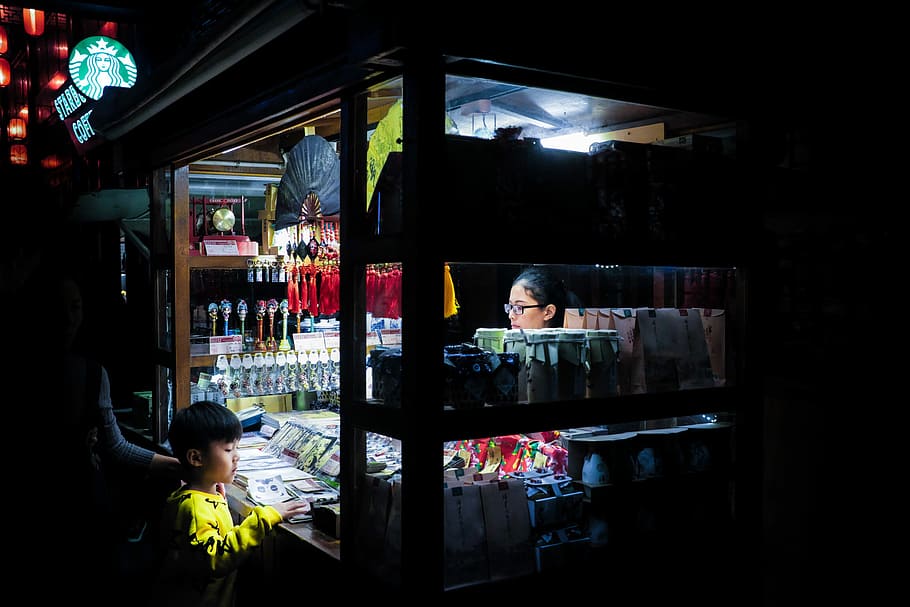woman and boy in food stall at night time, store at the night HD wallpaper