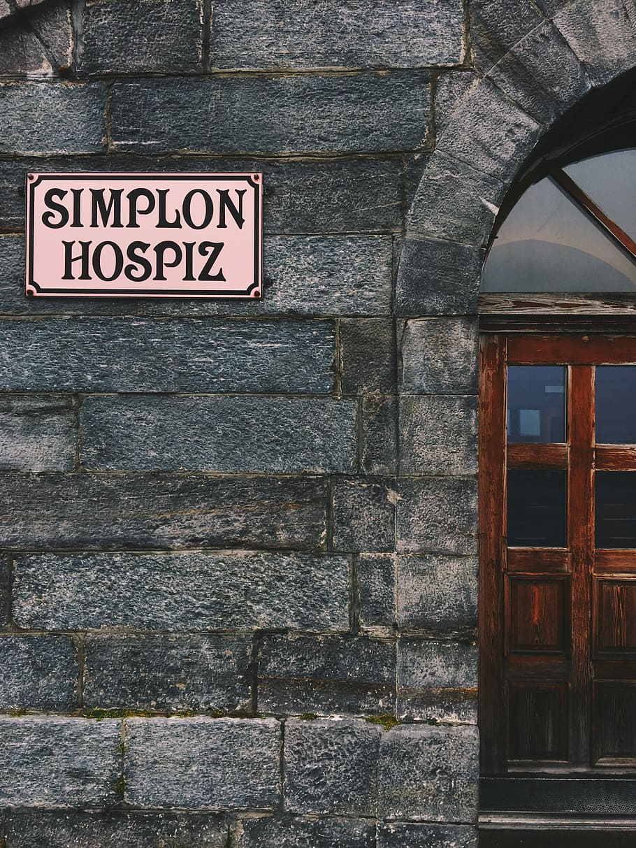 beige Simplon Hospiz signboard on wall, Simplon Hospiz signage, HD wallpaper