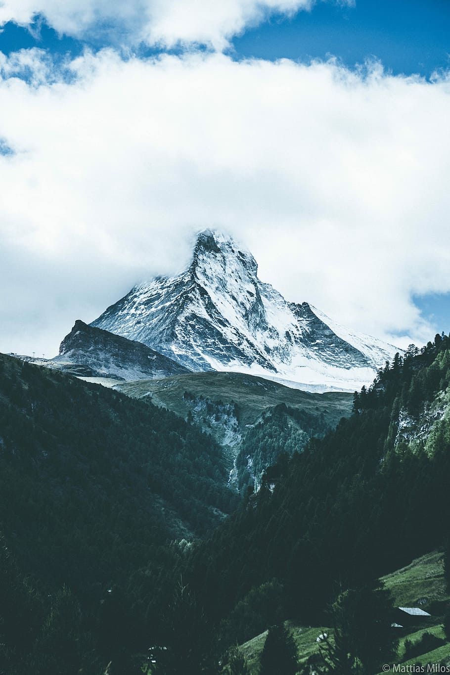 mountain covered by clouds, black mountain snow covered under white sky HD wallpaper