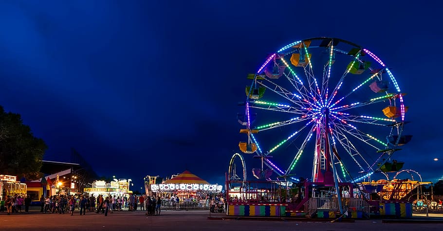 photography of ferris wheel during nighttime, wyoming, state fair