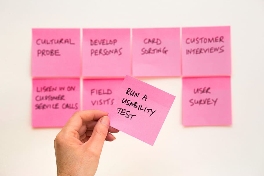person holding pink sticky note, Run A Usability Test sticky note, HD wallpaper