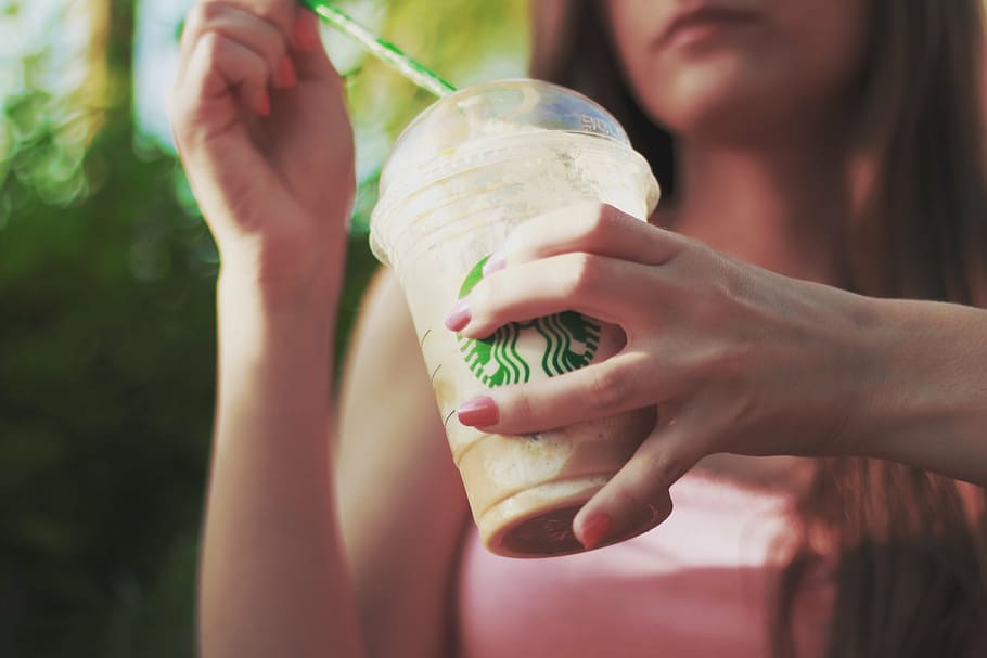 woman holding Starbucks cup, iced coffee, flurry, drink, softdrink