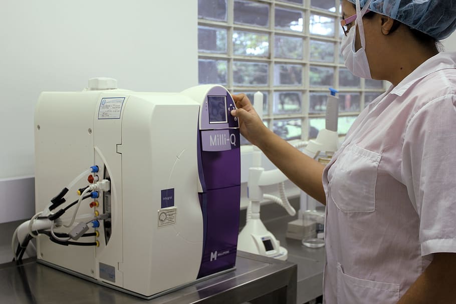 woman pressing button on machine, Diagnosis, Lab, Tests, Microscope