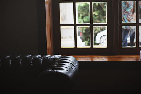 leather brown couch, tufted black leather sofa near brown wooden framed window inside the room HD wallpaper