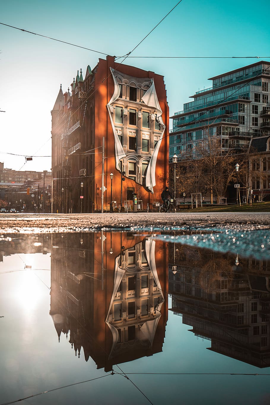 brown concrete building with water reflection, brown establishment during daytime HD wallpaper