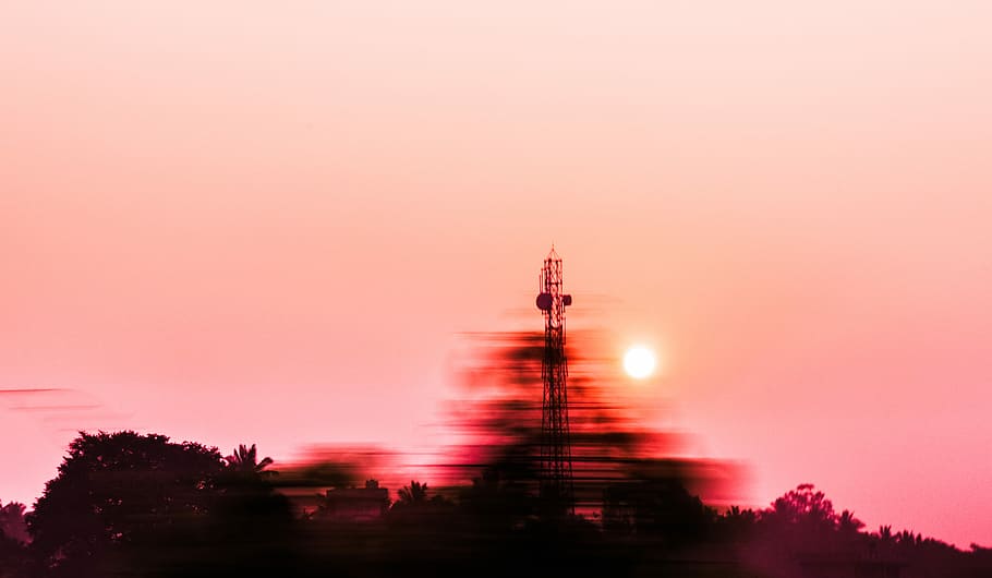 timelapse photograph of tower, silhouette of signal tower beside trees HD wallpaper