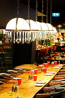 white pendant lamps turned on, dining table, restaurant, eating HD wallpaper