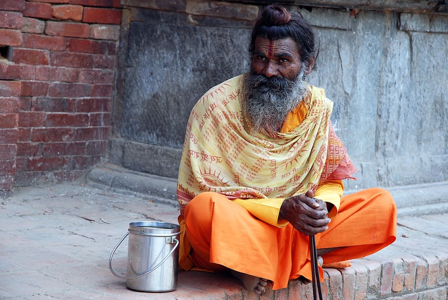 man in orange coat sitting near wall, nepal, yogi, hinduism, sa, HD wallpaper