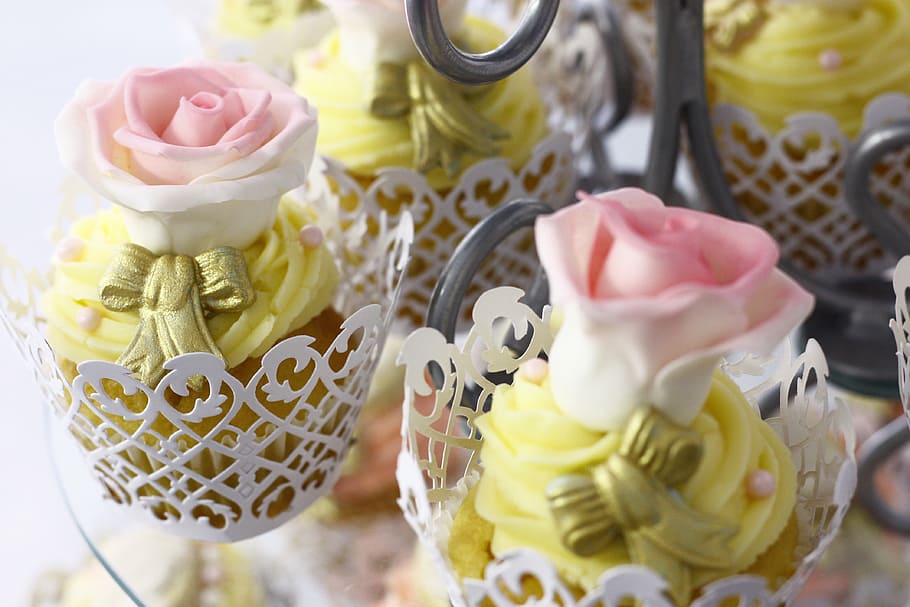 group of pink-and-white roses party favors, rose-themed cupcakes on white steel holder