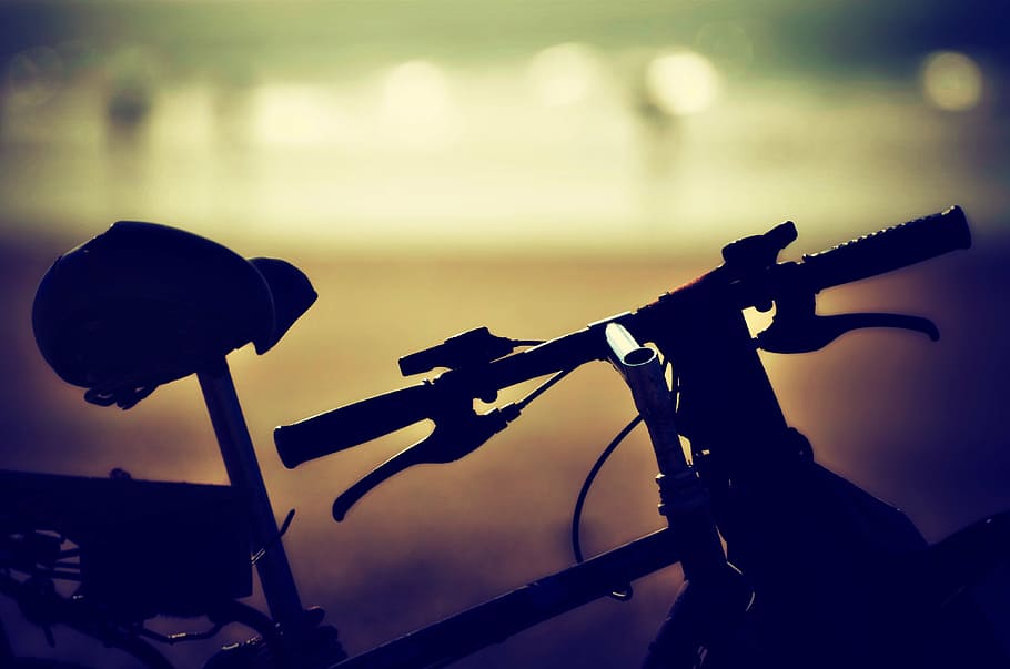 selective focus photography black hardtail bike, bicycle, sunset
