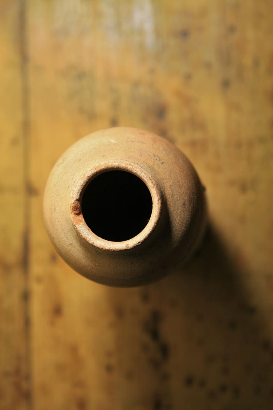 top view of beige clay pot, vase, ornament, elongated, ceramic