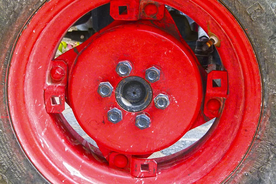 wheel, rim, nuts, tractor, red, close-up, metal, no people HD wallpaper