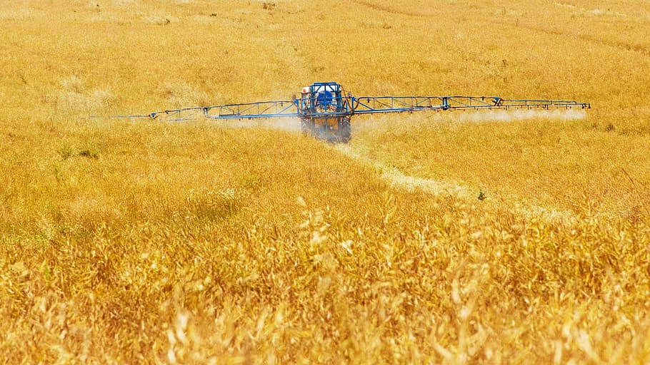black harvester on field during daytime, agriculture, chemical