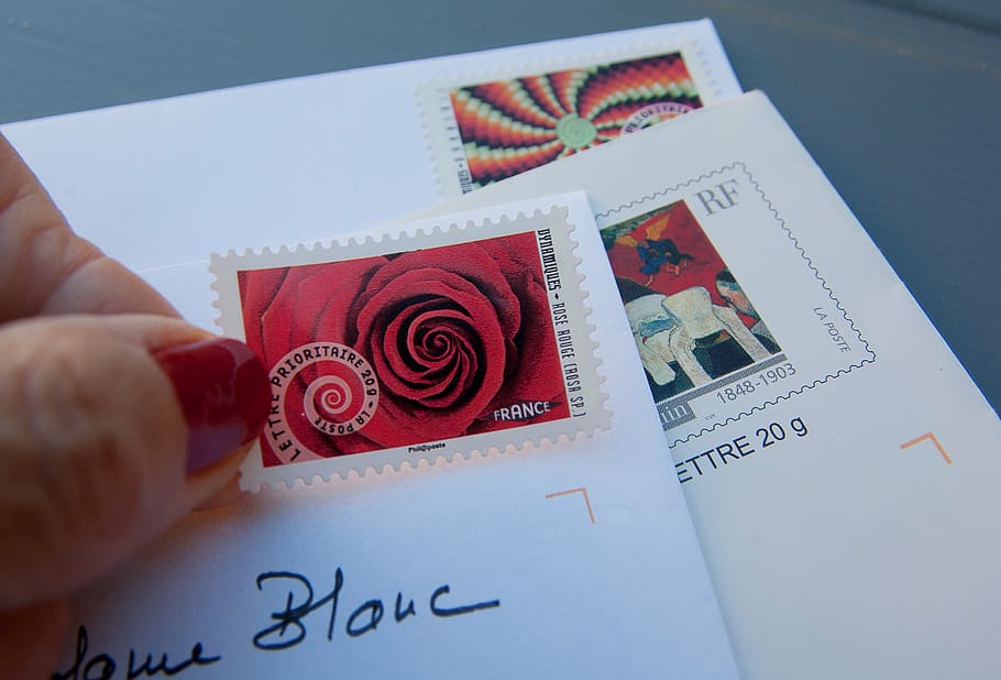 person holding red and white postage stamp, stamps, letters, mail, HD wallpaper