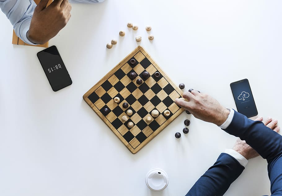 two persons playing chess, game, mobile phone, hand, men, business