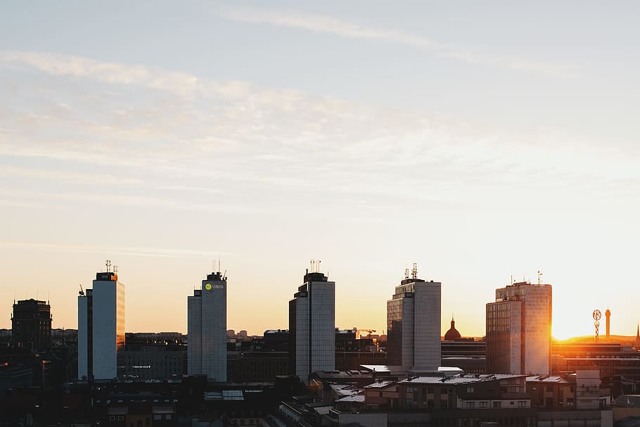 five white high-rise buildings under gray sky, city buildings during daytime HD wallpaper