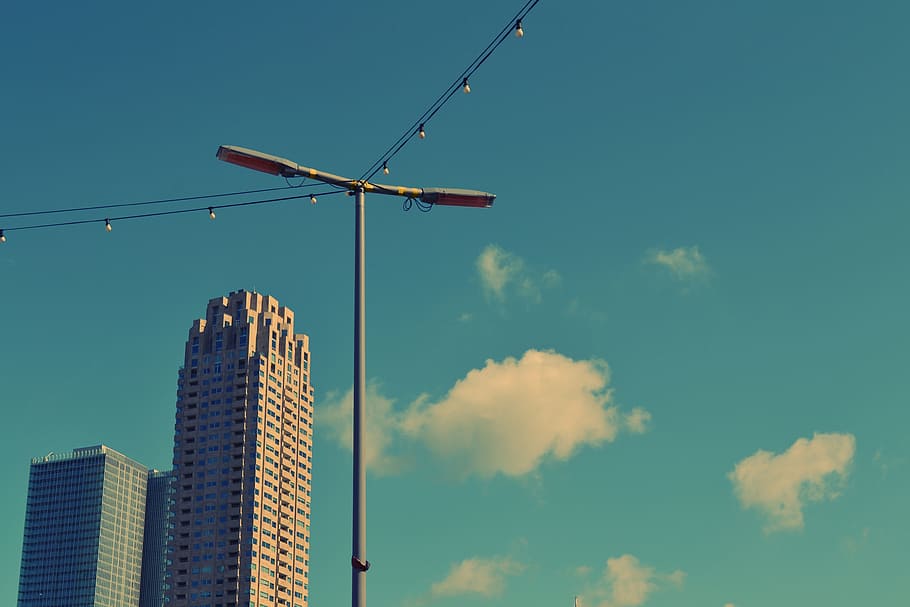 blue, sky, clouds, lamp post, string lights, buildings, towers HD wallpaper