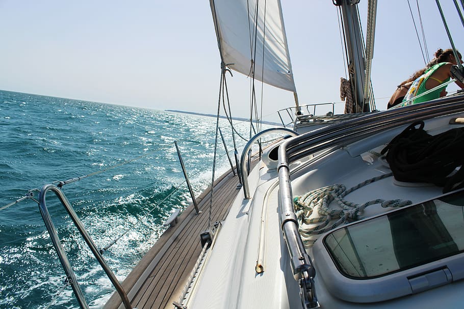 white motorboat tilted on water during daytime, white yacht leaned on body of water during daytime HD wallpaper