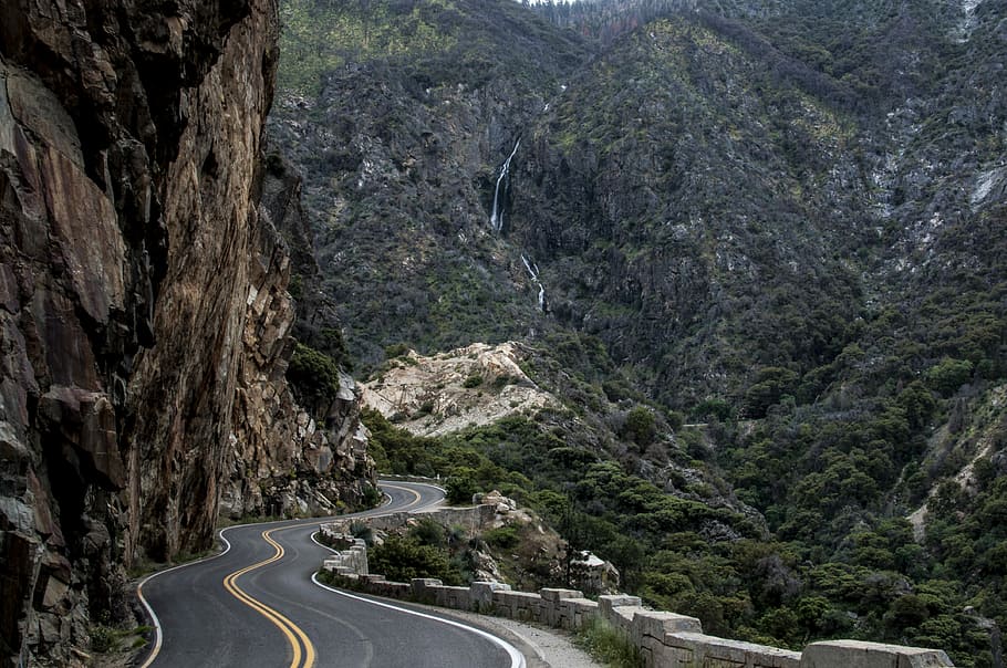 asphalt road beside cliff, road surrounded of mountain, trees HD wallpaper