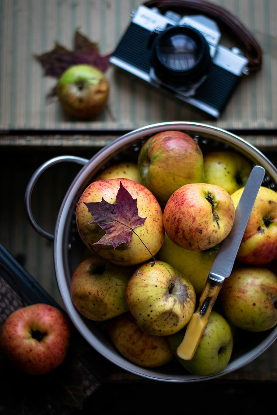 flat lay photography of pot of apples, fruit, bowl, knife, camera HD wallpaper
