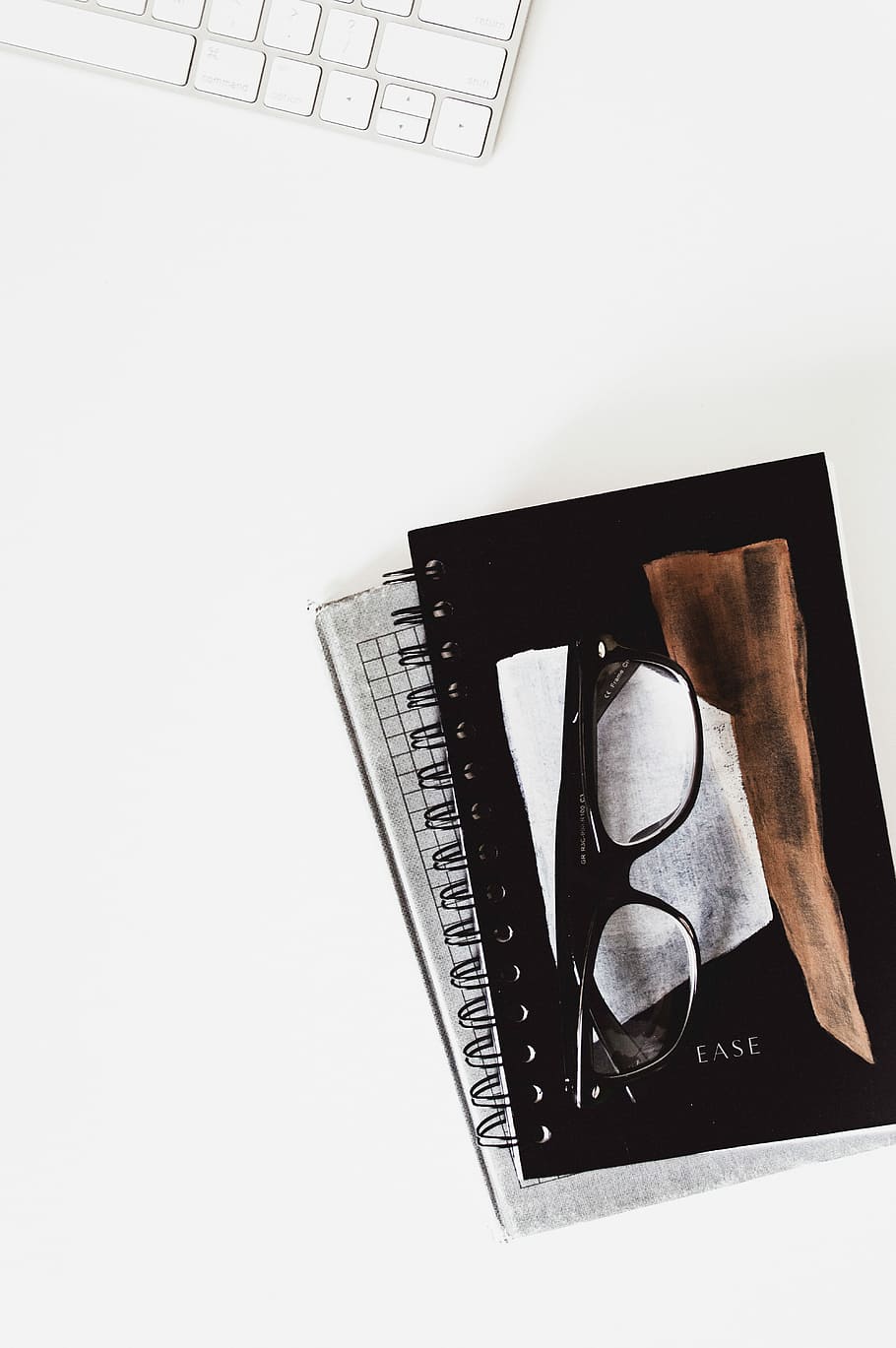 eyeglasses with black frames on black notebook, eyeglasses on black notebook HD wallpaper