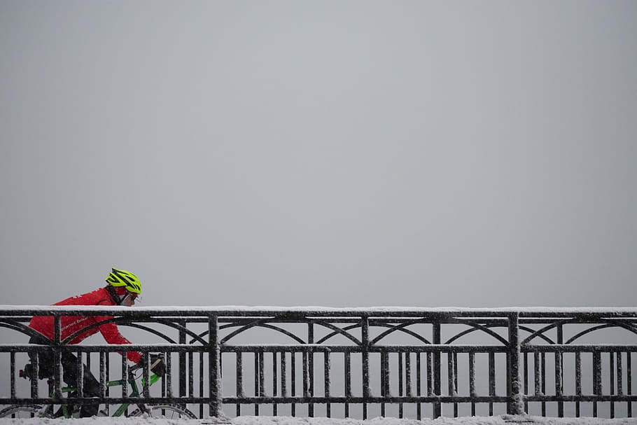 man in red jacket riding bike on bridge, man riding on bicycle passing on black metal bridge HD wallpaper