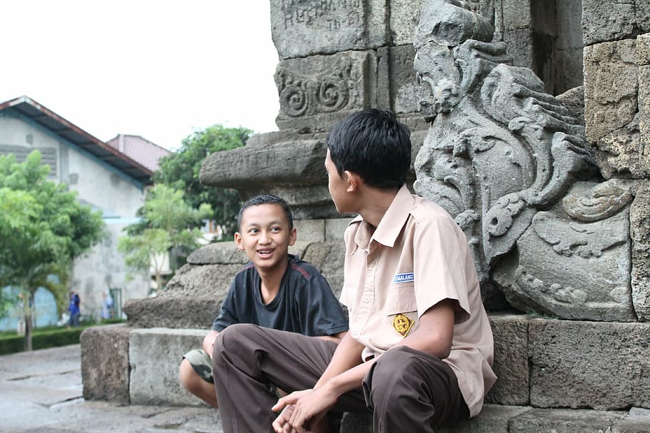 two boys sitting on gray concrete monument, conversation, people HD wallpaper