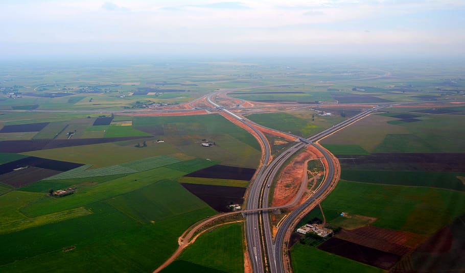 aerial view of freeway between green fields, top view photo of asphalt road between grass field, HD wallpaper