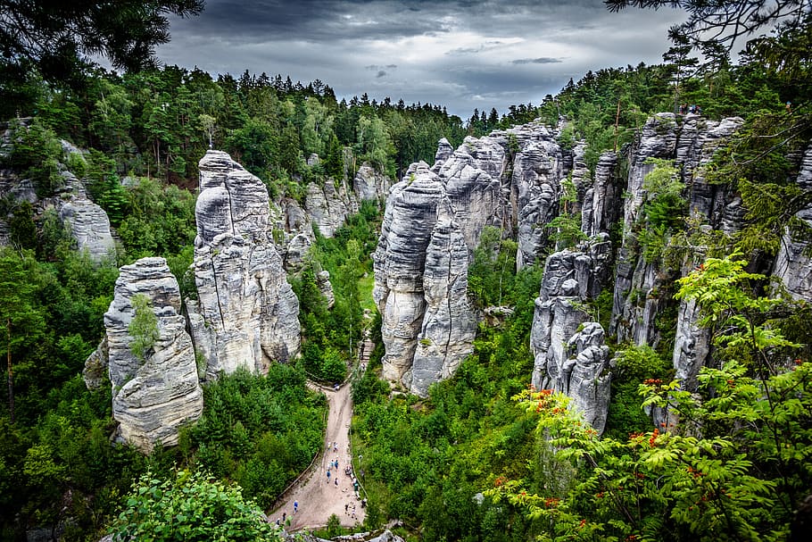 aerial photography of gray rock monoliths surrounded by trees HD wallpaper