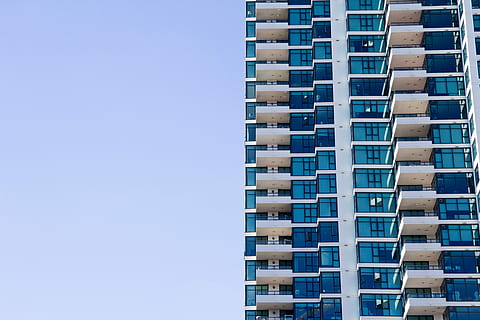 white and blue painted building under the clear sky during daytime HD wallpaper