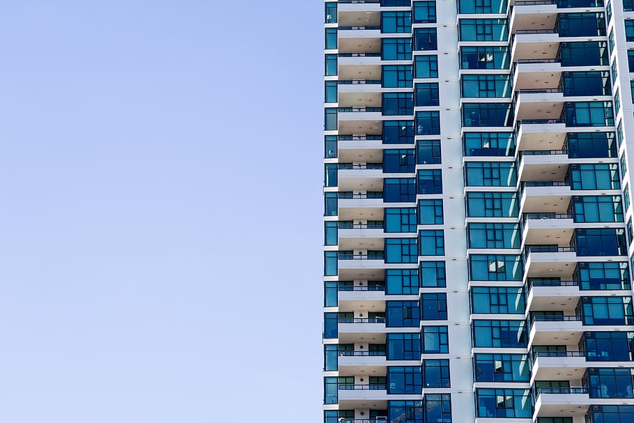 white and blue painted building under the clear sky during daytime HD wallpaper