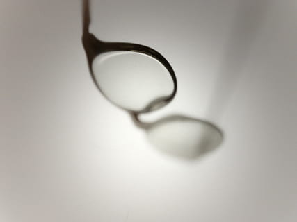 eyeglasses with black metal frames, white, falling, blurry HD wallpaper