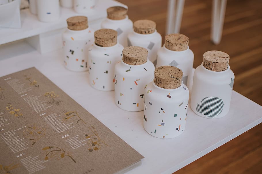 white ceramic containers on white tray, eight white cork vials HD wallpaper