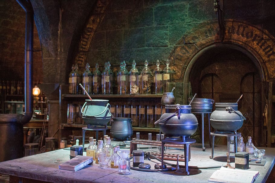 pots with rod on metal stand surrounded with bottles, Harry Potter