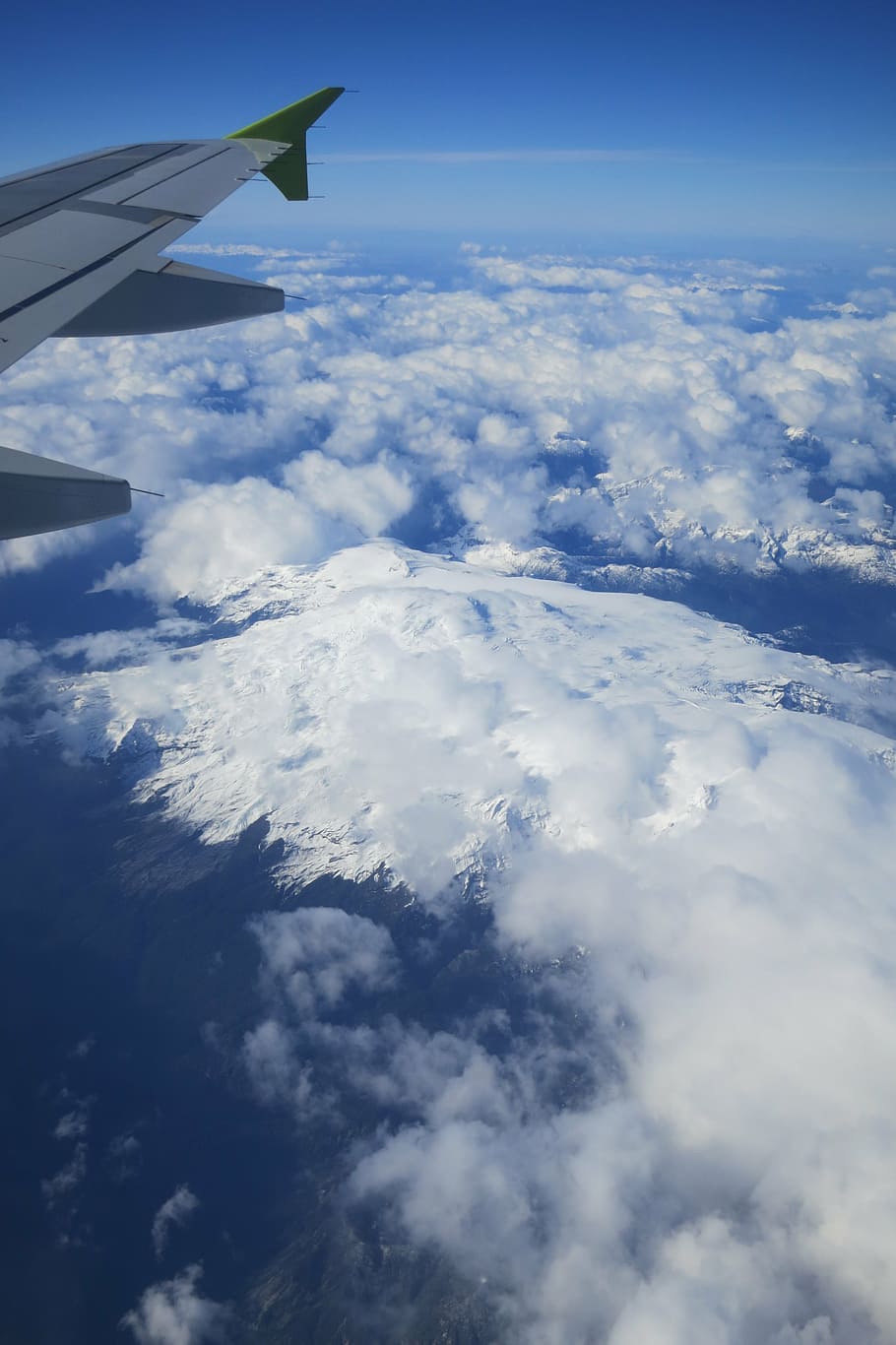 bird's eye view photo of mountain alps, arial, shot, clouds, daytime