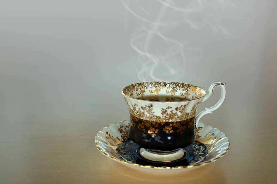 photography of white teacup filled with hot coffee, cup of tea