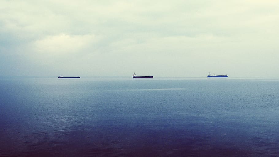 silhouette of ships on body of water, oil-tankers, supertankers