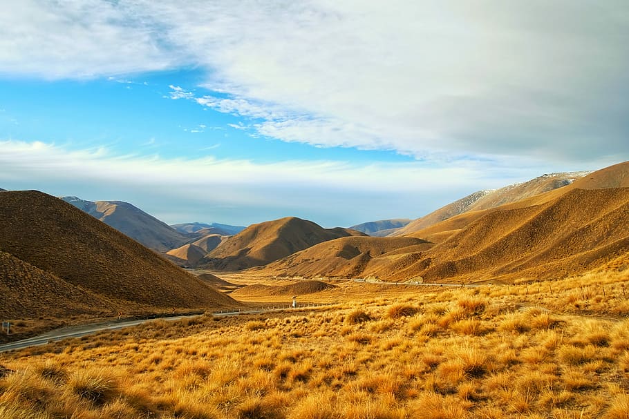 aerial photography of mountain at daytime, brown grass near mountain HD wallpaper