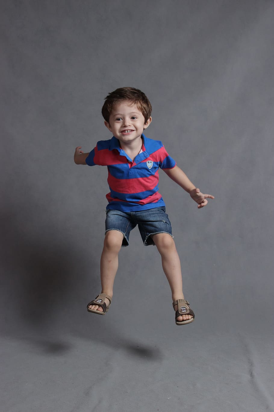 boy in blue and red polo shirt and blue denim boat shorts, happy HD wallpaper